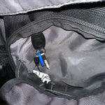 Interior view of a backpack showing keys attached with a lanyard, showcasing organization convenience.