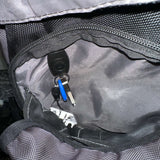 Interior view of a backpack showing keys attached with a lanyard, showcasing organization convenience.