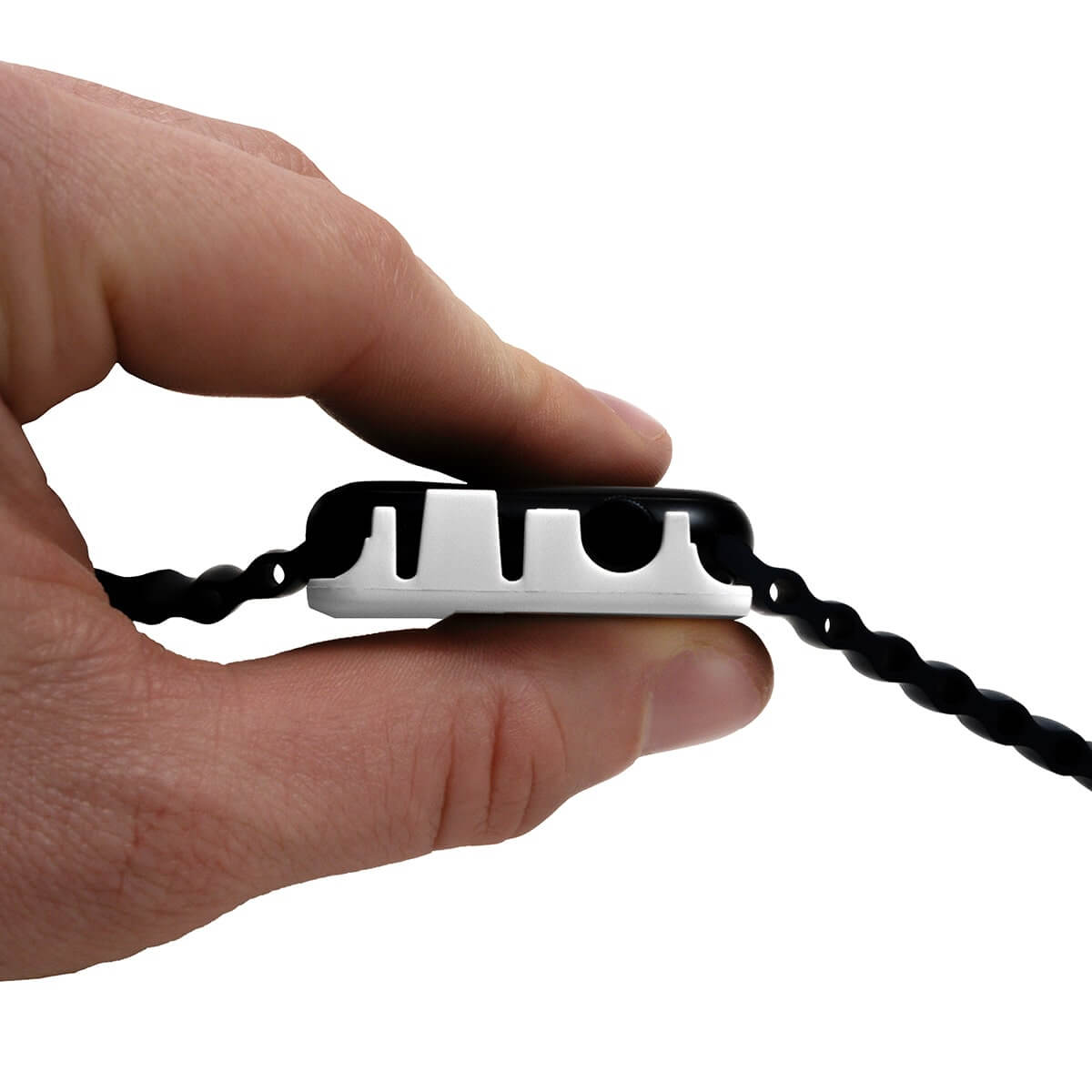 Close-up of a hand holding the SwapBandIt® tool for easy band changes, showcasing its sleek design and functionality.